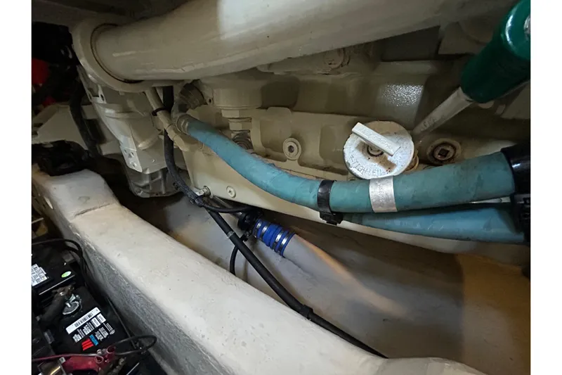 Blue Diamond Yacht Photos Pics Engine compartment of a 2005 Sea Ray 500 Sundancer with visible hoses and components.