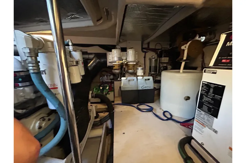 Blue Diamond Yacht Photos Pics Engine room of 2005 Sea Ray 500 Sundancer with various mechanical components.