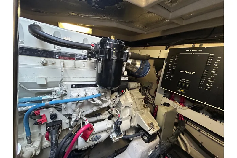 Blue Diamond Yacht Photos Pics Engine room of 2005 Sea Ray 500 Sundancer with visible components and control panel.