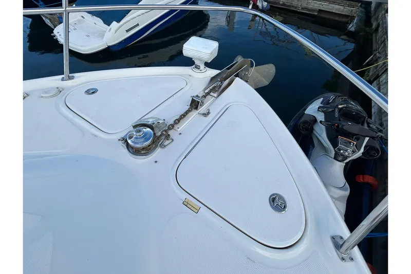 Blue Diamond Yacht Photos Pics Bow of 2005 Sea Ray 500 Sundancer with anchor and winch, docked near watercraft.
