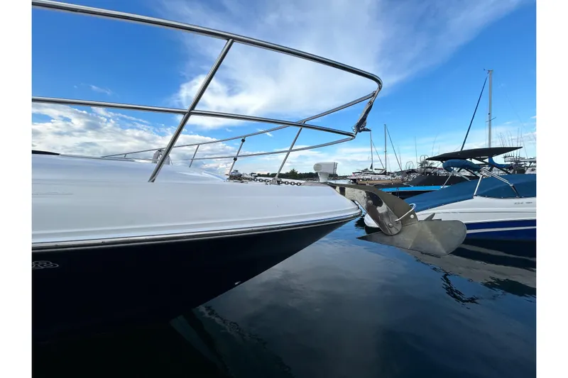 Blue Diamond Yacht Photos Pics 2005 Sea Ray 500 Sundancer yacht docked at marina under clear blue sky.