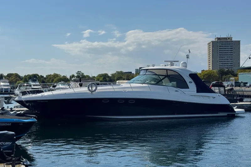 Blue Diamond Yacht Photos Pics 2005 Sea Ray 500 Sundancer yacht docked in a marina, clear sky background.