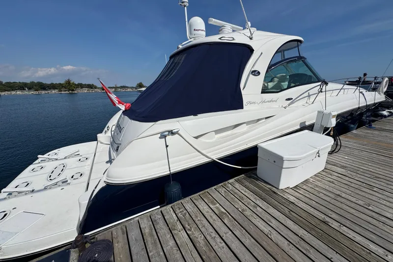 Blue Diamond Yacht Photos Pics 2005 Sea Ray 500 Sundancer yacht docked at a marina, featuring sleek design and spacious deck.