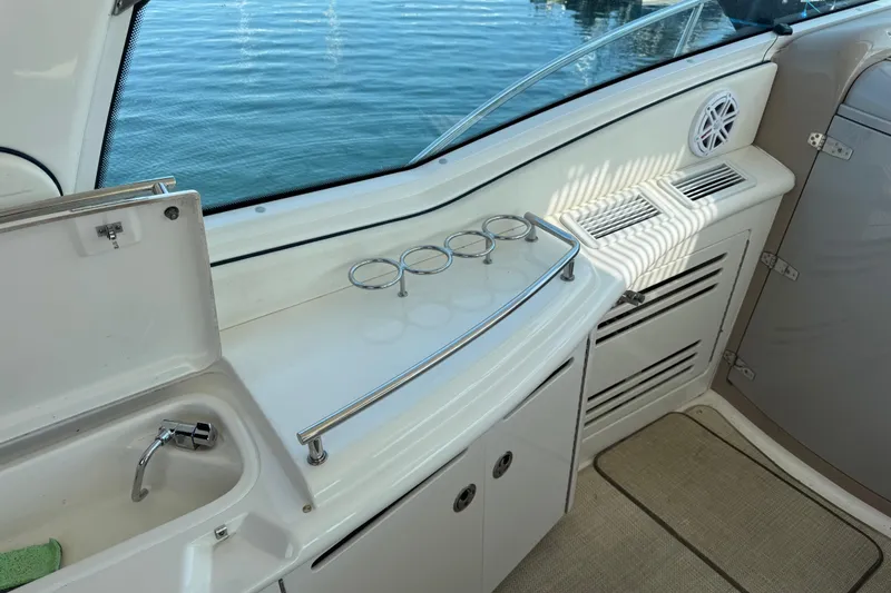 Blue Diamond Yacht Photos Pics 2005 Sea Ray 500 Sundancer yacht interior with sink, cup holders, and storage.