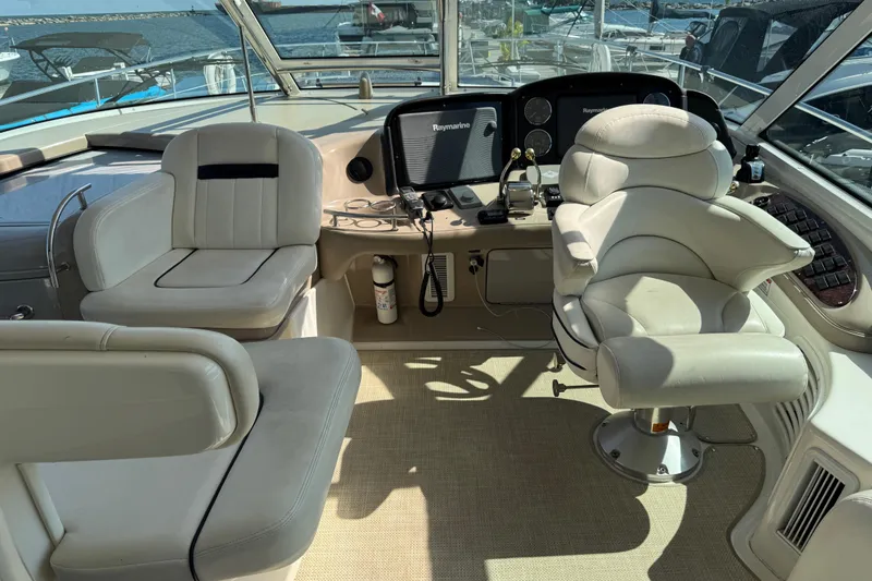 Blue Diamond Yacht Photos Pics Luxurious 2005 Sea Ray 500 Sundancer yacht cockpit with plush seating and advanced navigation equipment.