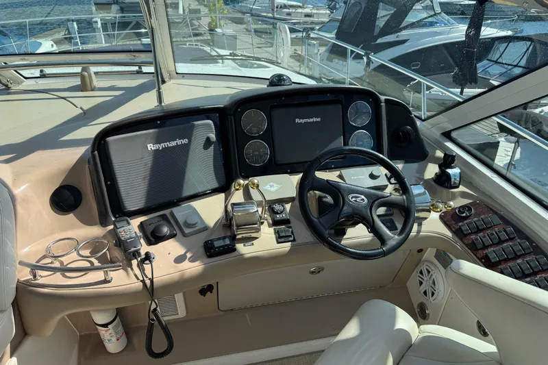 Blue Diamond Yacht Photos Pics Helm of 2005 Sea Ray 500 Sundancer with Raymarine navigation system.