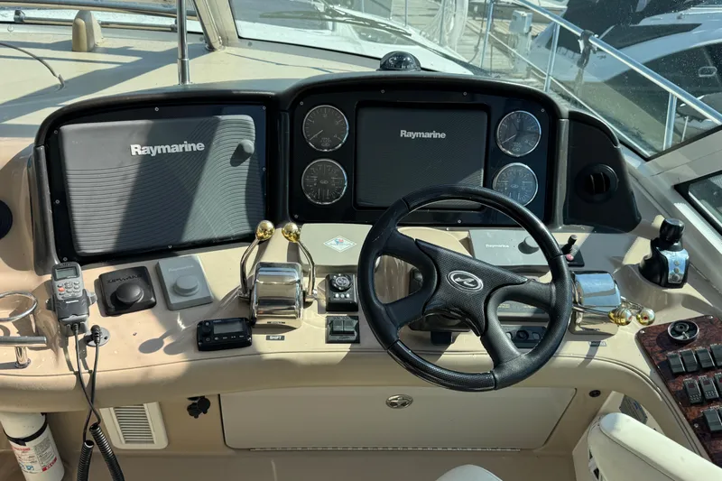 Blue Diamond Yacht Photos Pics Control panel of a 2005 Sea Ray 500 Sundancer yacht with Raymarine navigation systems.