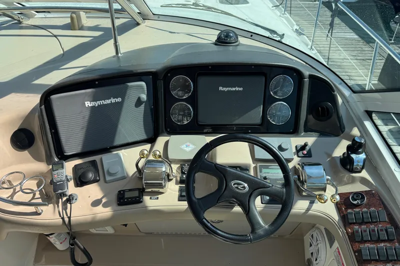 Blue Diamond Yacht Photos Pics Control panel of a 2005 Sea Ray 500 Sundancer yacht with Raymarine navigation equipment.