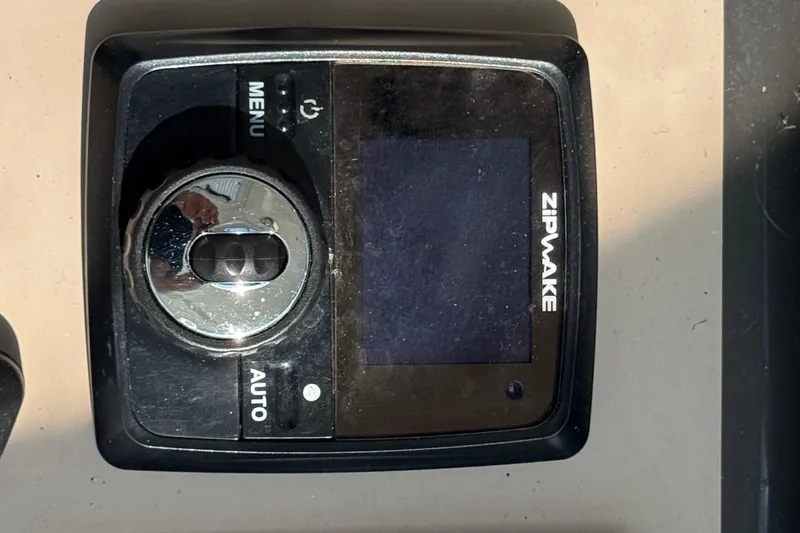 Blue Diamond Yacht Photos Pics Zipwake control panel on a 2005 Sea Ray 500 Sundancer boat dashboard.