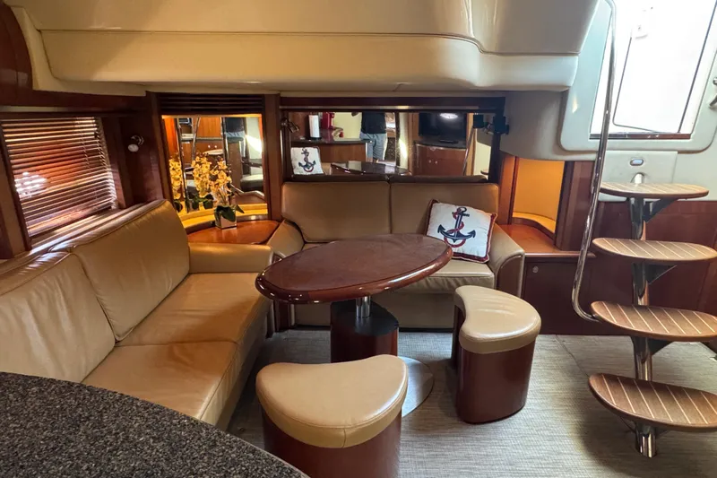 Blue Diamond Yacht Photos Pics Luxurious 2005 Sea Ray 500 Sundancer yacht interior with elegant seating and wooden accents.