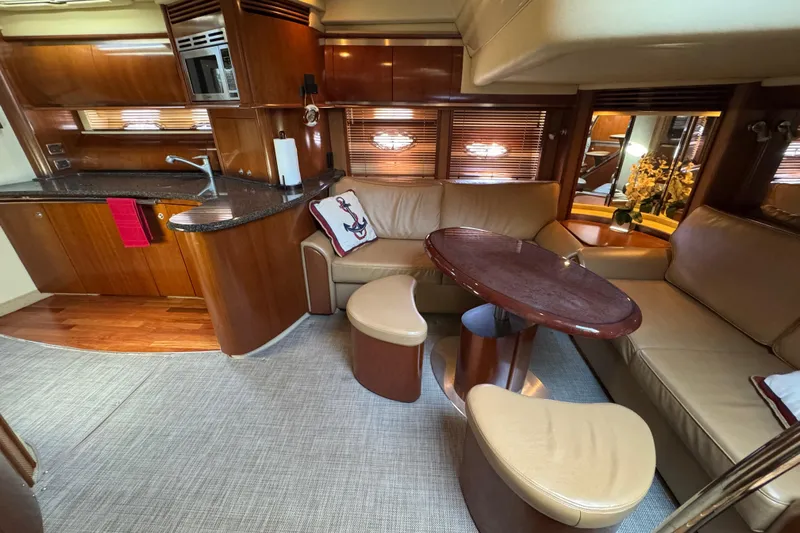 Blue Diamond Yacht Photos Pics Luxurious 2005 Sea Ray 500 Sundancer yacht interior with elegant seating and kitchen area.