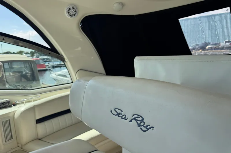 Blue Diamond Yacht Photos Pics Interior of 2005 Sea Ray 500 Sundancer yacht with white seating and marina view.
