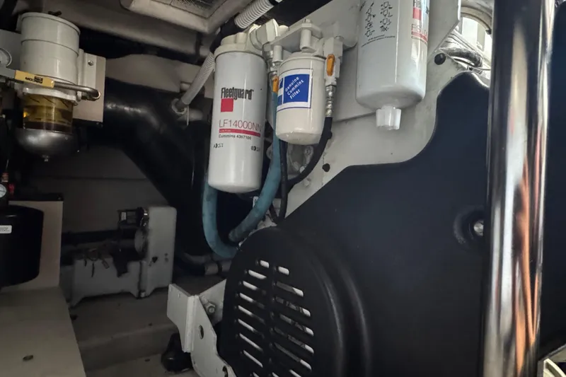 Blue Diamond Yacht Photos Pics Engine room of 2005 Sea Ray 500 Sundancer with visible filters and components.