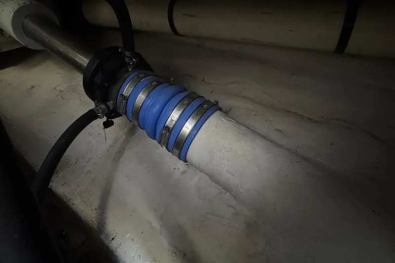 Blue Diamond Yacht Photos Pics Engine room detail of a 2005 Sea Ray 500 Sundancer, showing a blue hose connection.