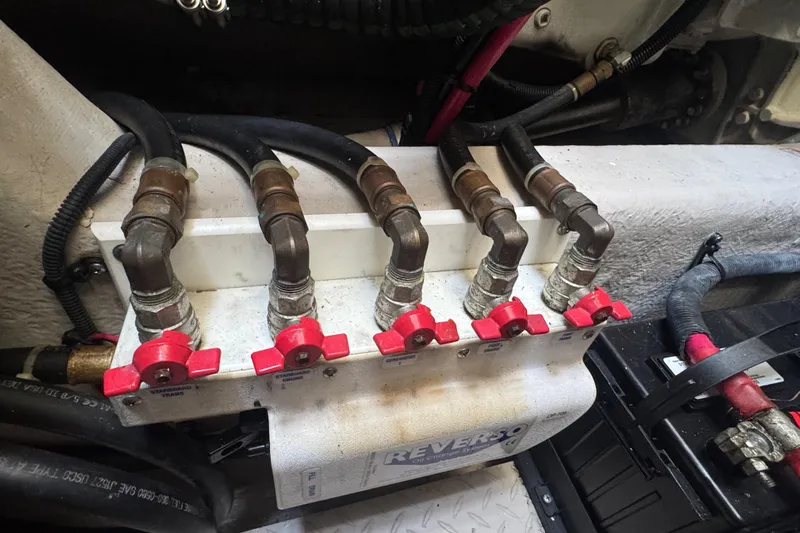 Blue Diamond Yacht Photos Pics Engine compartment of 2005 Sea Ray 500 Sundancer with fuel line valves and hoses.