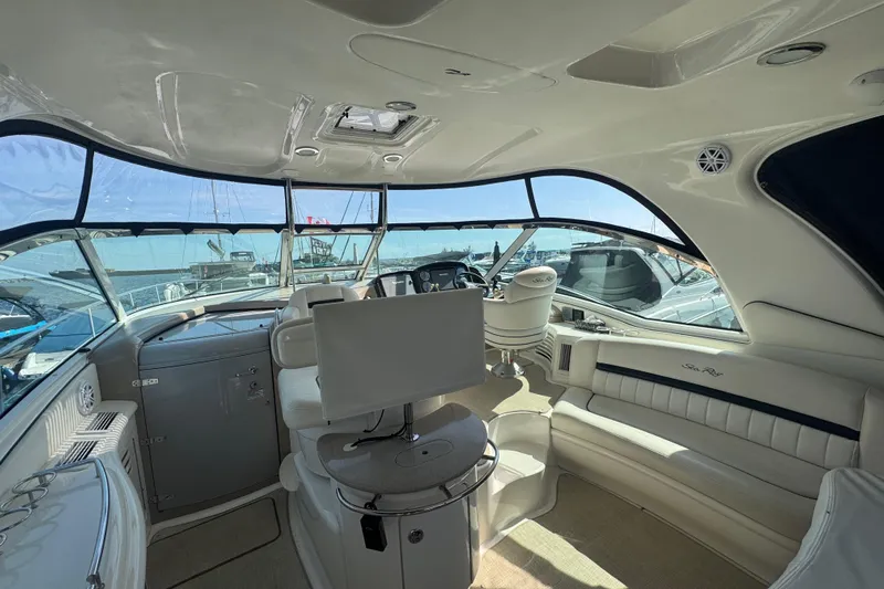 Blue Diamond Yacht Photos Pics Interior of 2005 Sea Ray 500 Sundancer yacht, featuring luxurious seating and helm station.
