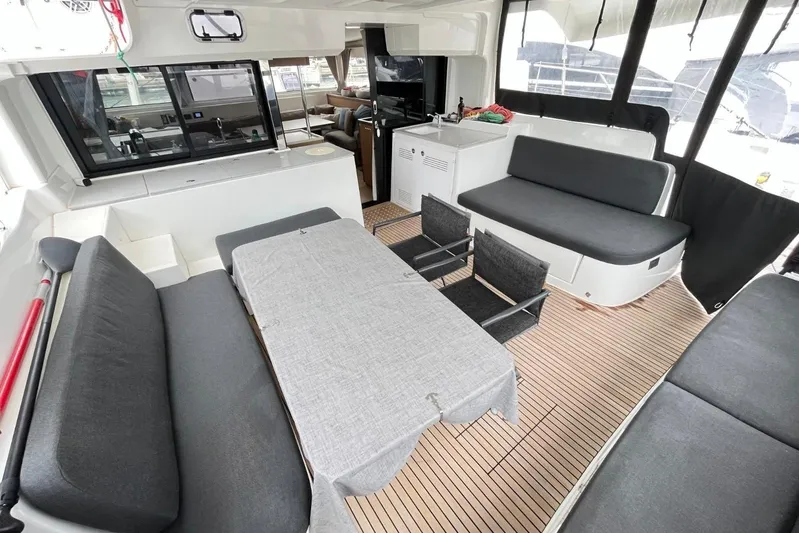 Alegr&iacute;a Yacht Photos Pics 2020 Lagoon 46 yacht interior with modern seating and dining area.