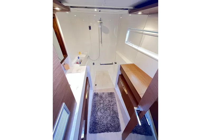 Alegr&iacute;a Yacht Photos Pics Luxurious bathroom interior of 2020 Lagoon 46 yacht with modern fixtures and elegant design.