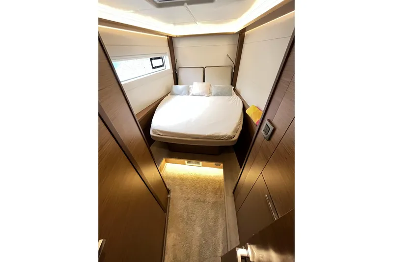Alegr&iacute;a Yacht Photos Pics Luxurious cabin interior of 2020 Lagoon 46 yacht with cozy bed and modern design.