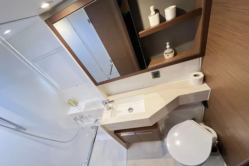 Alegr&iacute;a Yacht Photos Pics Modern bathroom interior of 2020 Lagoon 46 yacht, featuring sleek fixtures and ample storage.