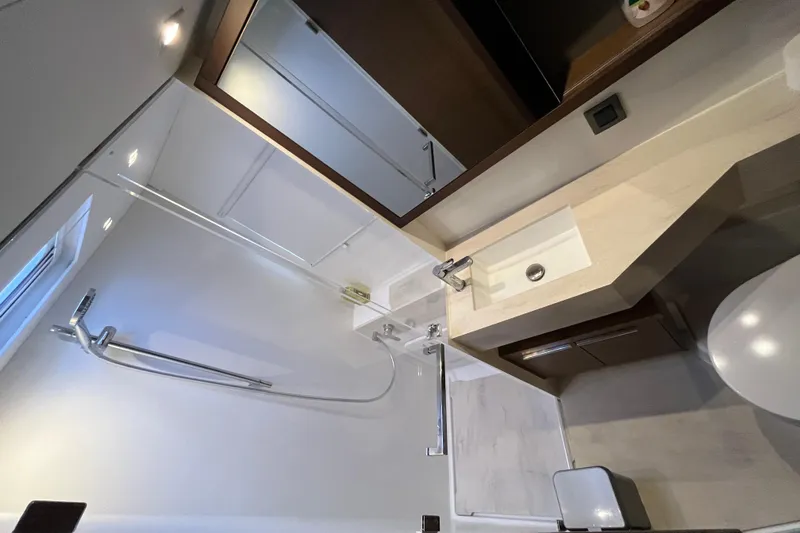 Alegr&iacute;a Yacht Photos Pics Modern bathroom interior of 2020 Lagoon 46 yacht with sleek fixtures and shower.