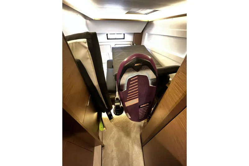 Alegr&iacute;a Yacht Photos Pics Interior of 2020 Lagoon 46 yacht cabin with a wakeboard stored inside.