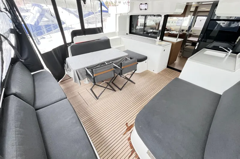 Alegr&iacute;a Yacht Photos Pics Spacious 2020 Lagoon 46 yacht interior with seating, table, and modern design.