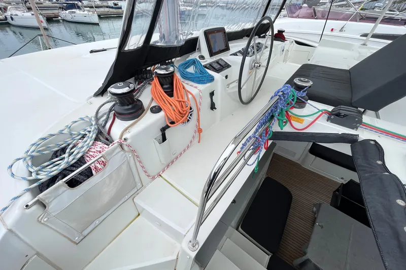 Alegr&iacute;a Yacht Photos Pics Helm station of 2020 Lagoon 46 catamaran with ropes and navigation equipment.