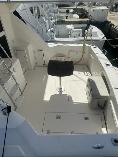  Yacht Photos Pics 2004 Riviera 37 Convertible yacht deck with seating and storage.