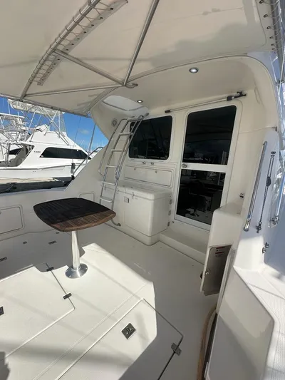  Yacht Photos Pics 2004 Riviera 37 Convertible yacht deck with seating and ladder.