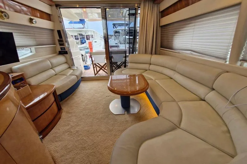 Nina Yacht Photos Pics Luxurious interior of a 2000 Azimut 52 yacht with plush seating and elegant decor.