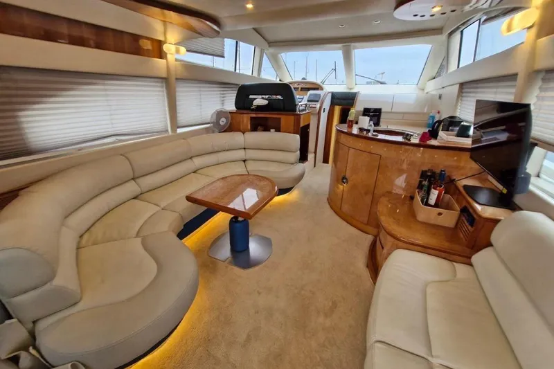 Nina Yacht Photos Pics Luxurious interior of a 2000 Azimut 52 yacht with elegant seating and modern amenities.