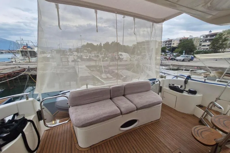 Nina Yacht Photos Pics Luxurious 2000 Azimut 52 yacht deck with comfortable seating and marina view.