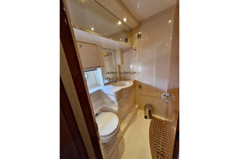 Nina Yacht Photos Pics Luxurious bathroom in a 2000 Azimut 52 yacht, featuring modern fixtures and elegant design.