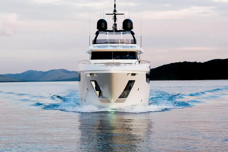 Sk Yacht Photos Pics Luxurious 2019 Custom Line Navetta 33 yacht cruising on serene waters.
