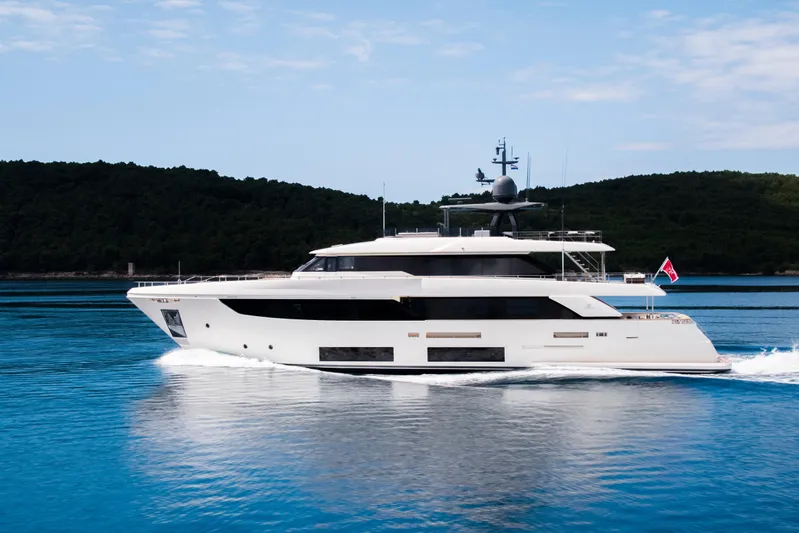 Sk Yacht Photos Pics 2019 Custom Line Navetta 33 yacht cruising on serene blue waters.