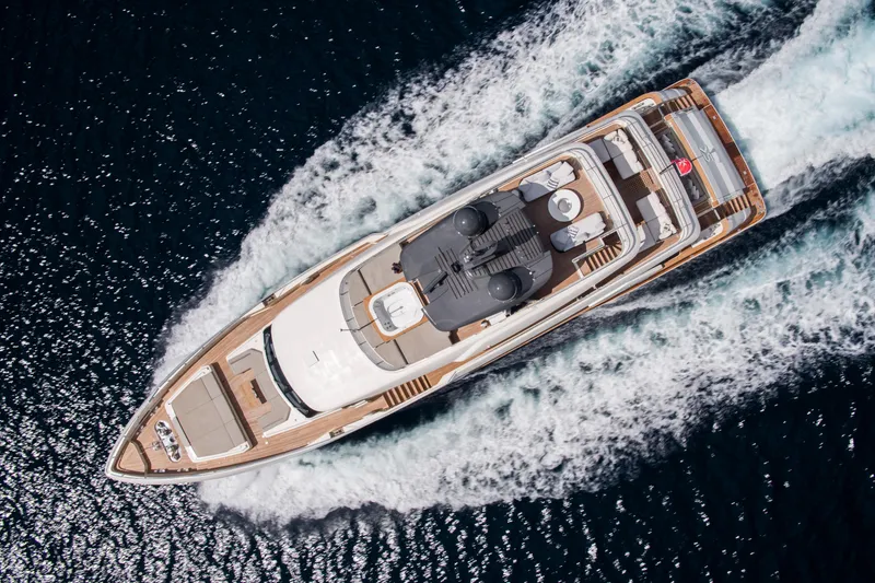 Sk Yacht Photos Pics Aerial view of 2019 Custom Line Navetta 33 yacht cruising on the ocean.