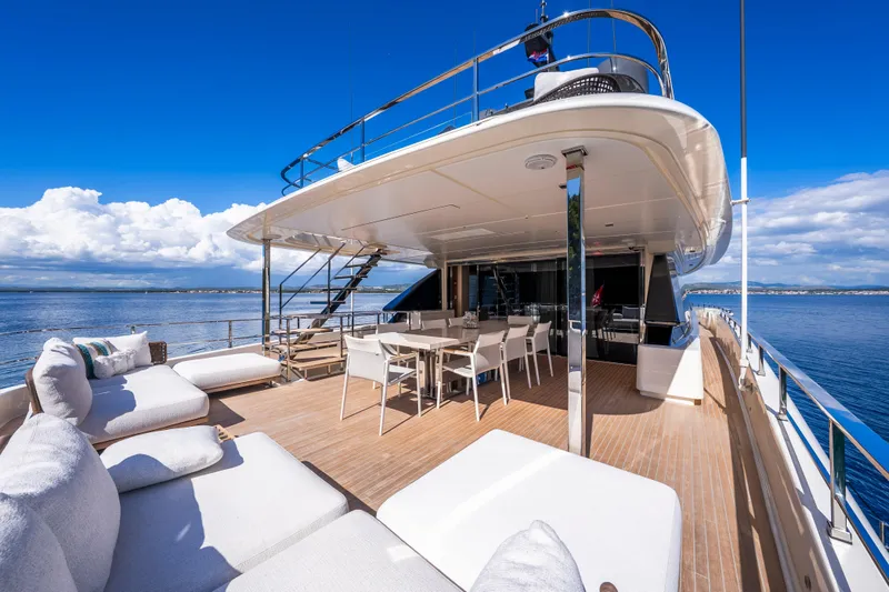 Sk Yacht Photos Pics Luxurious 2019 Custom Line Navetta 33 yacht deck with seating and dining area, ocean view.