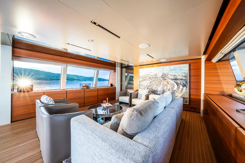 Sk Yacht Photos Pics Luxurious interior of 2019 Custom Line Navetta 33 yacht with elegant seating and scenic views.