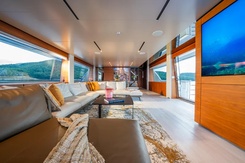 Sk Yacht Photos Pics Luxurious interior of 2019 Custom Line Navetta 33 yacht with modern decor and scenic views.