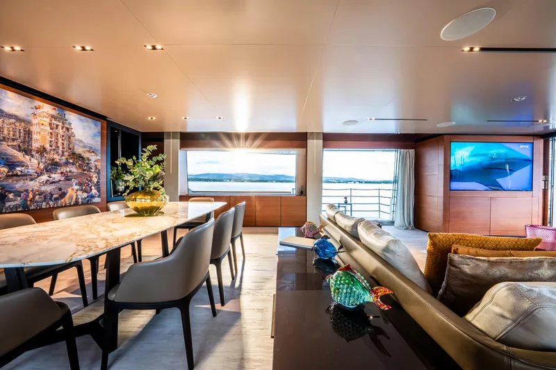Sk Yacht Photos Pics Luxurious interior of 2019 Custom Line Navetta 33 yacht with elegant dining area and scenic views.