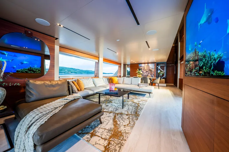 Sk Yacht Photos Pics Luxurious interior of 2019 Custom Line Navetta 33 yacht with elegant seating and large windows.
