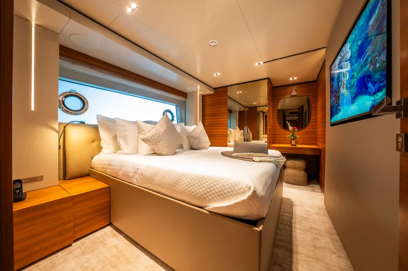 Sk Yacht Photos Pics Luxurious bedroom interior of 2019 Custom Line Navetta 33 yacht, featuring elegant decor and modern amenities.