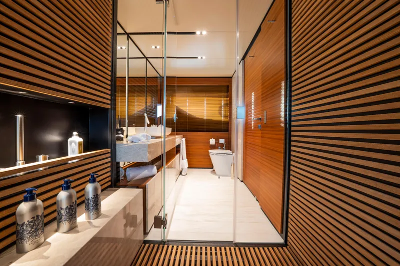 Sk Yacht Photos Pics Luxurious bathroom on 2019 Custom Line Navetta 33 yacht with modern wood paneling.