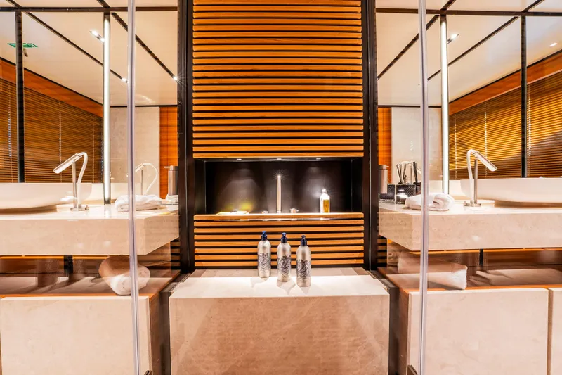 Sk Yacht Photos Pics Luxurious bathroom on 2019 Custom Line Navetta 33 yacht with modern sinks and elegant decor.