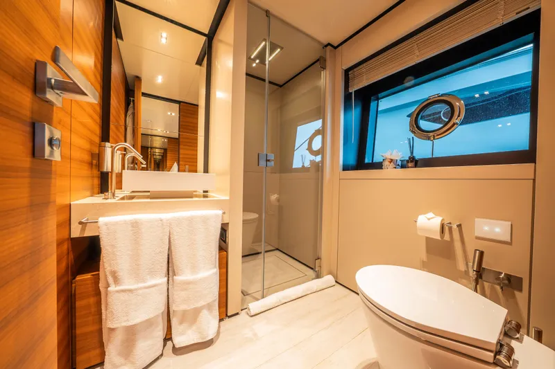 Sk Yacht Photos Pics Luxurious bathroom on 2019 Custom Line Navetta 33 yacht with modern fixtures and ocean view.