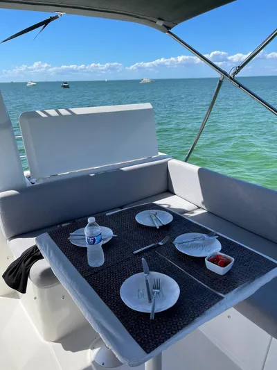  Yacht Photos Pics Beneteau Swift Trawler 41 Fly 2021 dining area with ocean view.