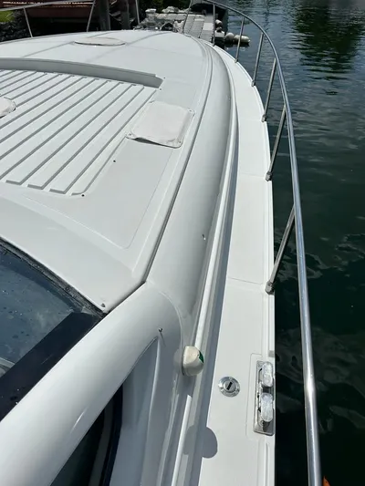 54' Pershing Express Yacht Photos Pics 1999 Pershing 54 yacht deck view with stainless steel railings.