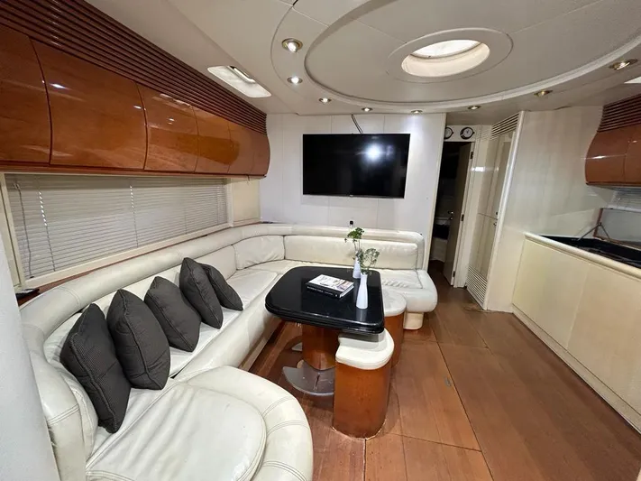 54' Pershing Express Yacht Photos Pics Luxurious interior of a 1999 Pershing 54 yacht with leather seating and modern amenities.