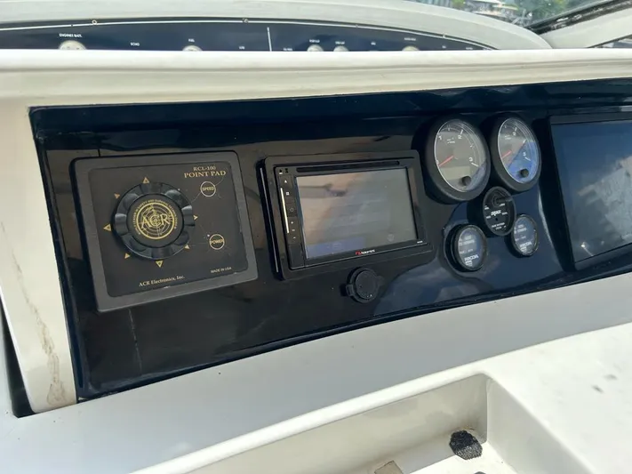 54' Pershing Express Yacht Photos Pics Dashboard of a 1999 Pershing 54 yacht with navigation controls and gauges.